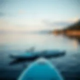 Calm Waters and Paddle Boards Average size paddle board on calm water