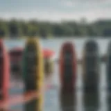 A close-up view of various wakeboards lined up, showcasing different sizes and shapes.