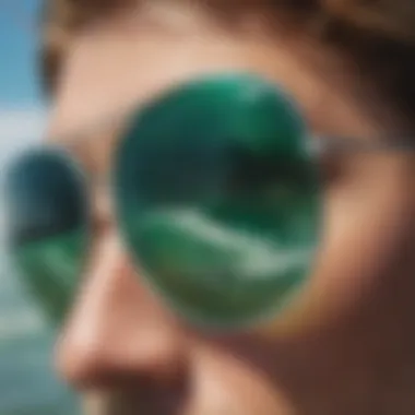 Close-up of emerald green sunglasses reflecting ocean waves