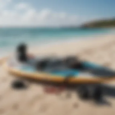 Essential kiteboarding equipment laid out on the beach ready for use.