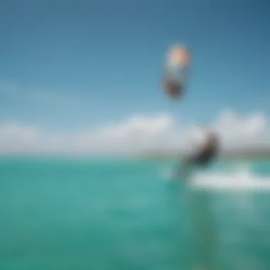 Kiteboarding in Aruba Kiteboarders gliding over the turquoise waters of Aruba.