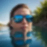 Costa Fantail Blue Mirror sunglasses reflecting sunlight over water