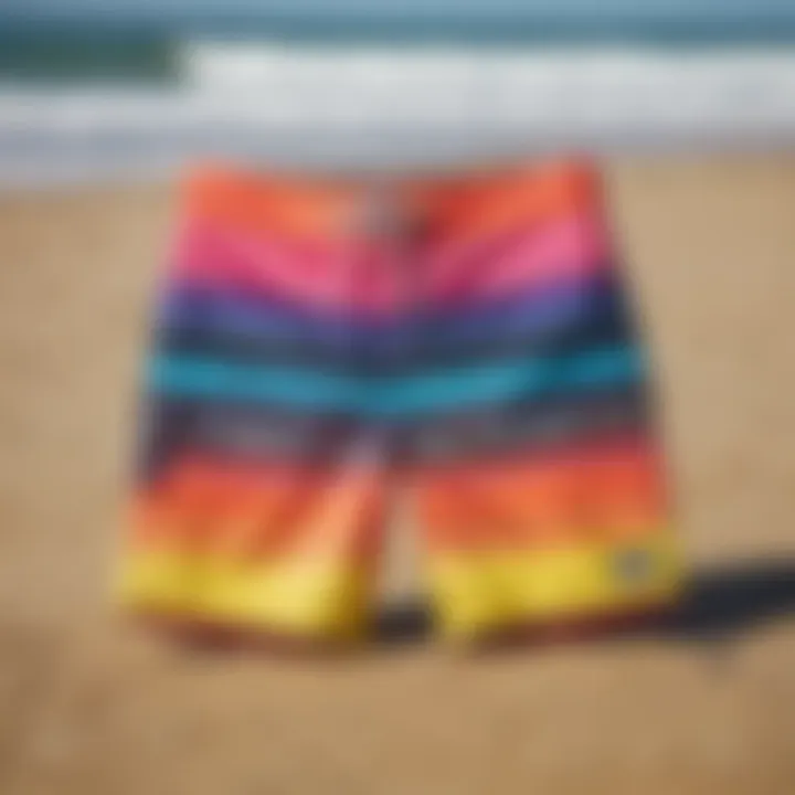 Vibrant neon boardshorts displayed on a sandy beach