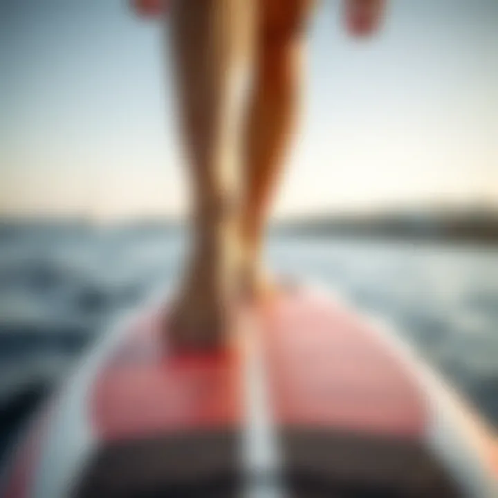 Focus on Stability: Feet on Balance Board Close up of feet on surf balance board emphasizing stability