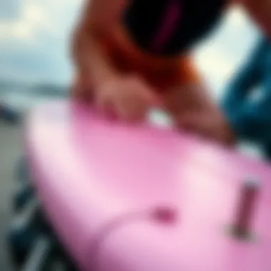 Close-up of pink long board detailing and craftsmanship.