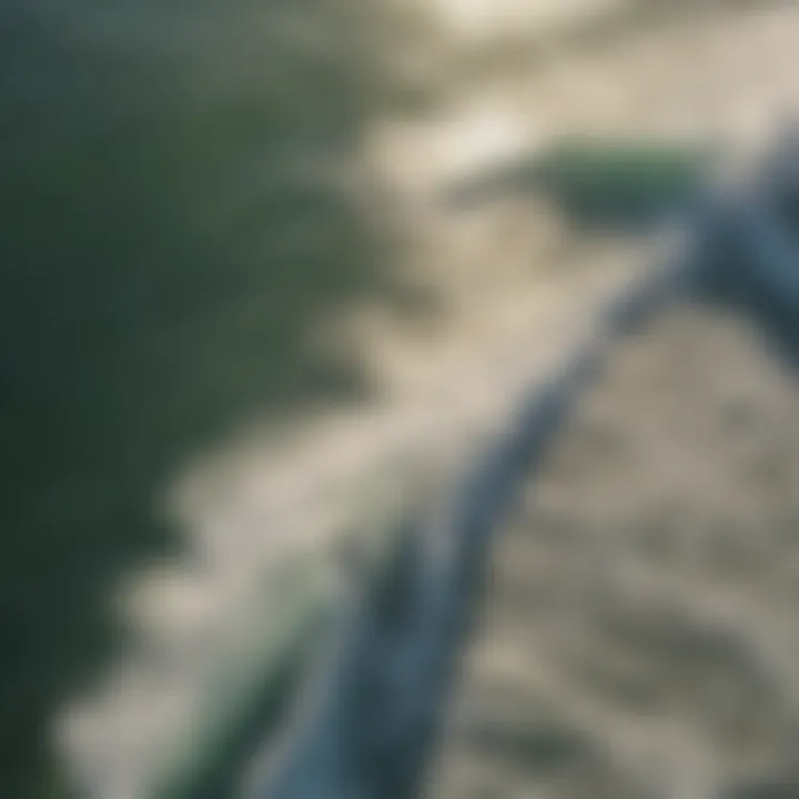 Aerial view of surfers in the ocean with sun rays shining down