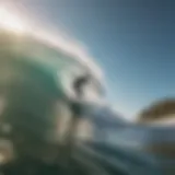 A surfer riding a wave under a bright sun