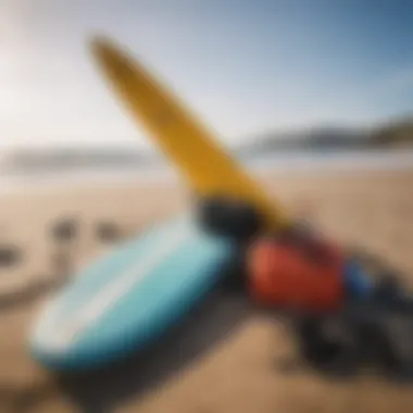 Essential surfing gear laid out on the beach ready for action.