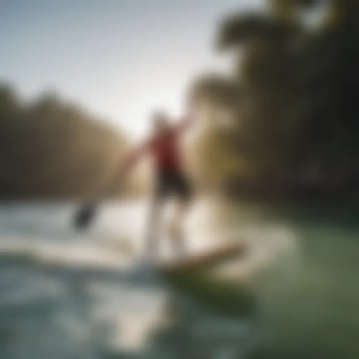 Stand-up paddleboarder catching air with an ollie