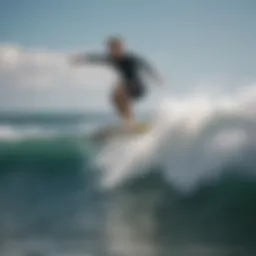 A surfer performing an ollie trick above the waves