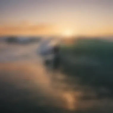 A breathtaking view of surfers riding the waves at sunrise in Los Angeles.