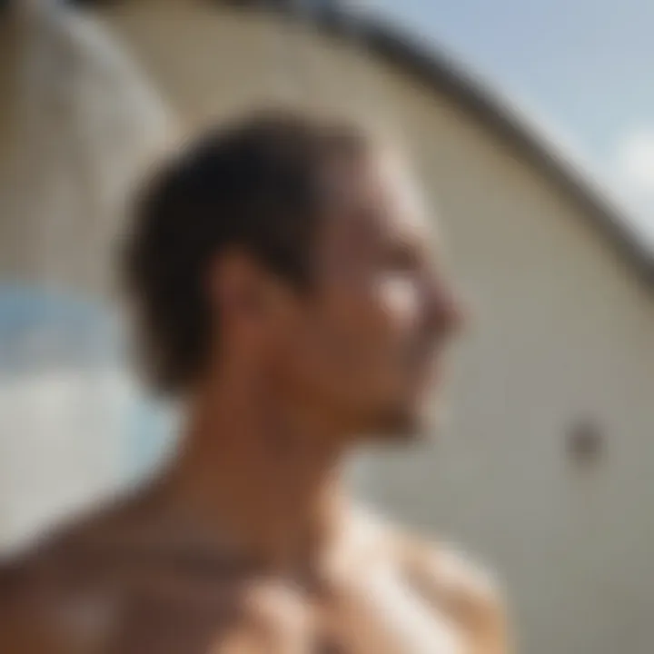 Close-up of a surfer rinsing off after a session in a portable shower