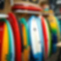 A collection of vibrant fiberglass skimboards displayed at a local shop