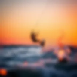 Kite surfer riding the waves at sunset