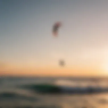 Kitesurfers enjoying a vibrant sunset on the water