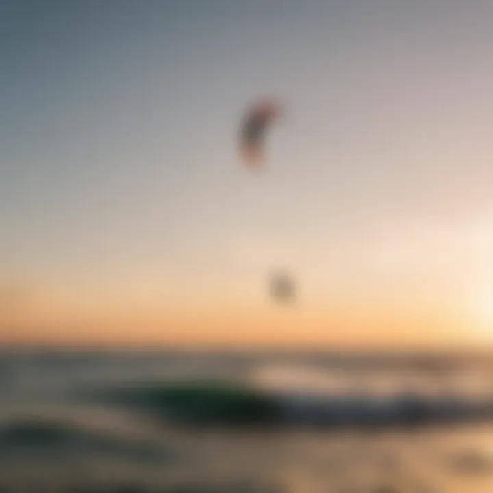 Kitesurfers enjoying a vibrant sunset on the water