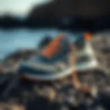 Stylish Olukai Nohea Mesh Shoe displayed on a rocky surface