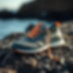 Stylish Olukai Nohea Mesh Shoe displayed on a rocky surface