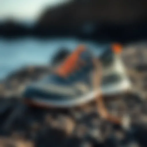 Stylish Olukai Nohea Mesh Shoe displayed on a rocky surface