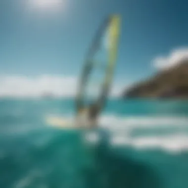 A windsurfer gliding across the turquoise waters of the isthmus