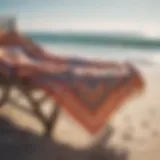 A stylish beach poncho draped over a sun lounger by the sea