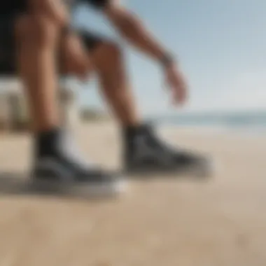 Surfer testing performance of Vans shoes on the beach