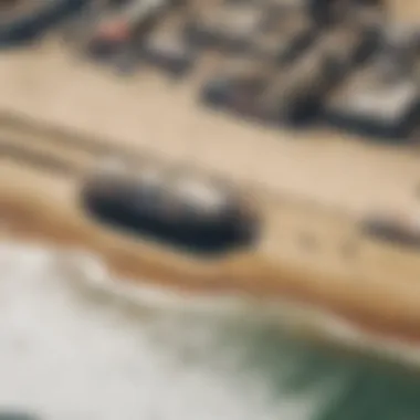 An aerial view of the iconic Santa Monica Pier with surfers in the ocean below.