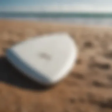 A close-up of a surfboard on the beach, representing the tools used in surf therapy.