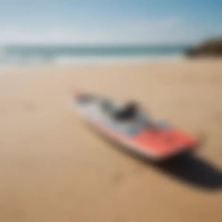 A kiteboard displayed on a sandy beach with waves in the background