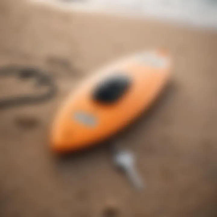 A surfboard and a surf car key lock box on the beach