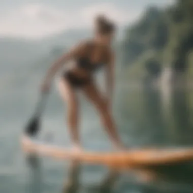 Paddle boarder performing yoga on water