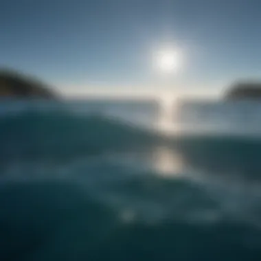 A serene view of a deep blue ocean reflecting sunlight