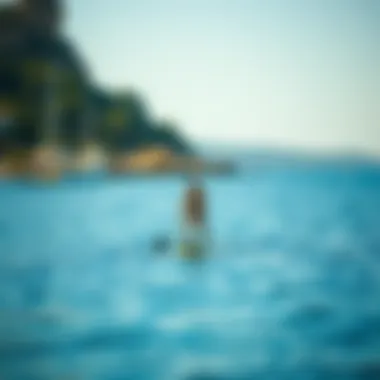 Paddleboarder navigating through calm coastal waters