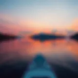 A serene lake reflecting a vibrant sunset with paddleboards