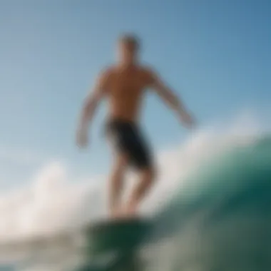 Model wearing Volcom elastic waist shorts while surfing