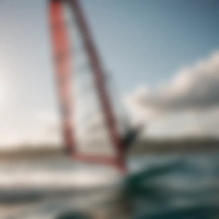 An athlete demonstrating maneuverability with a windsurf boom on the water