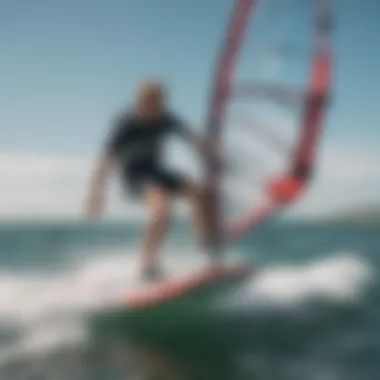 An instructor demonstrating advanced windsurfing techniques on the water