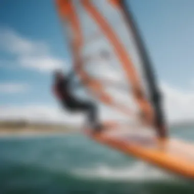 Close-up of windsurfing equipment including the sail and board