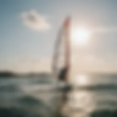 A beginner windsurfer enjoying their first lesson on calm waters